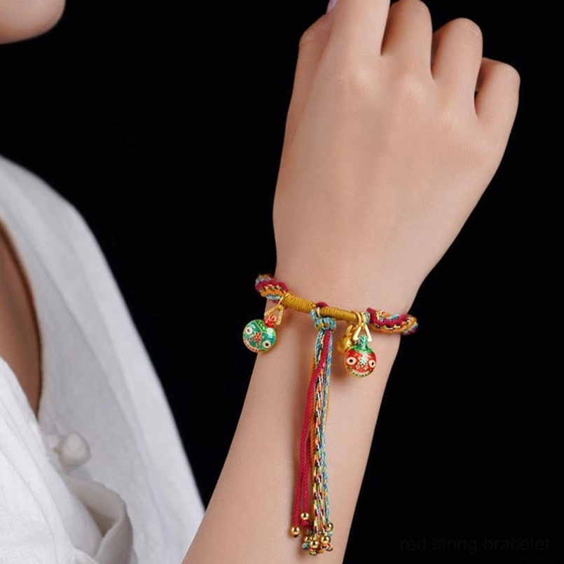 Gold pixiu family blessing reincarnation knot bracelet worn on wrist with matching pendant design