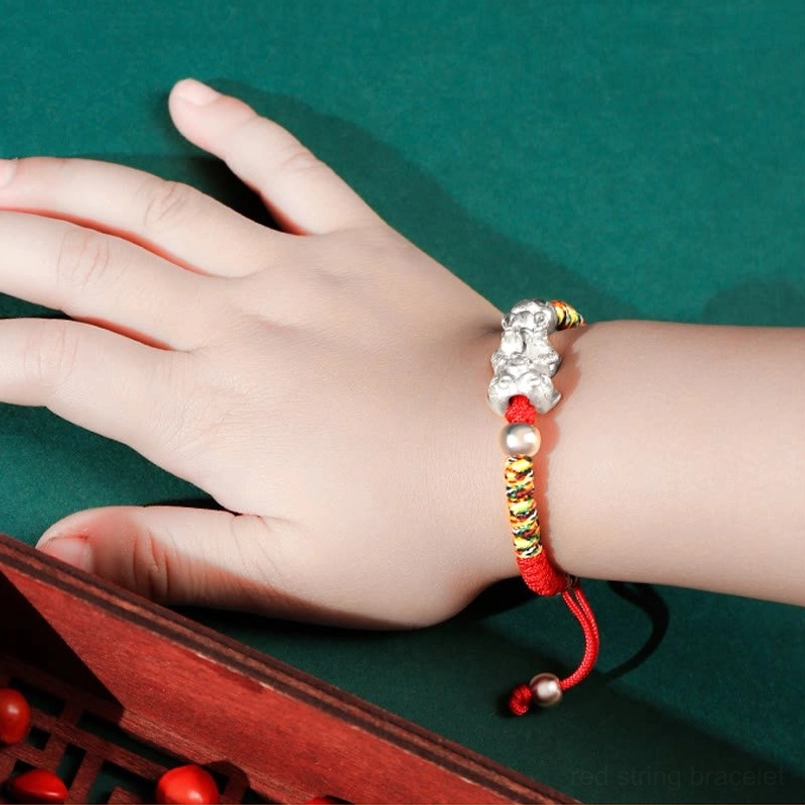 Pixiu charm kids bracelet showing 999 silver and gold-plated Pixiu detail