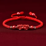 Pixiu cinnabar red string bracelet top-down view with adjustable sliding knot