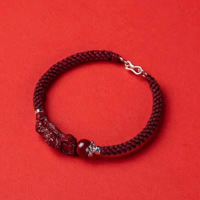 Handcrafted Pixiu cinnabar bracelet circular display with red cord and silver lobster clasp