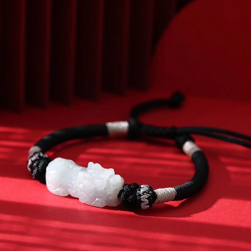 Natural jade Pixiu charm detail - overhead view of handmade prosperity bracelet