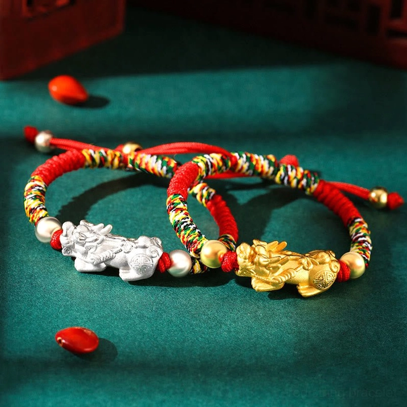 999 Sterling Silver Pixiu kids bracelet flat lay with red and multicolor braided rope options