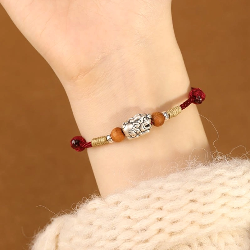 Red String Pixiu Bracelet with Braided Knot Closure - Back of Hand View