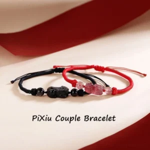 Pixiu couple braided bracelets red and black cord with obsidian and strawberry quartz charms flat lay