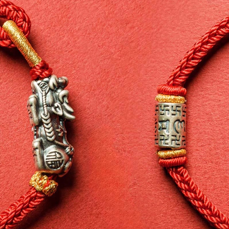 Red string Pixiu protection bracelet lifestyle wear showing how to style the spiritual charm bracelet