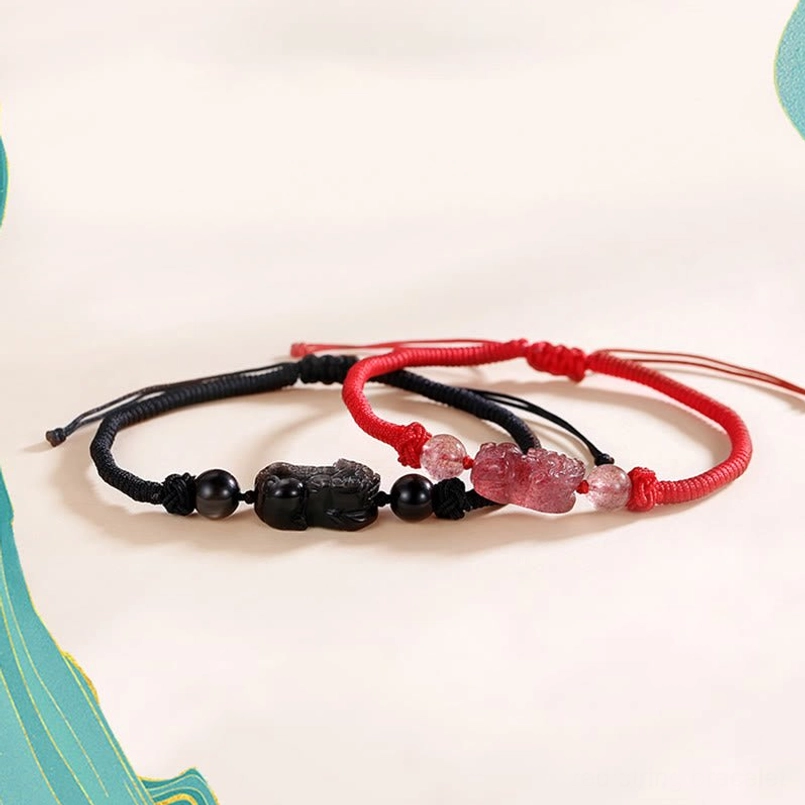 Red and black pixiu couple bracelets set flat lay strawberry quartz wealth charm