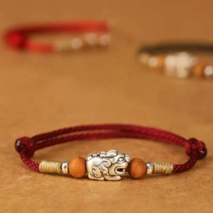 999 Sterling Silver Pixiu Peach Wood Bead Red String Bracelet - Flat Lay Front View