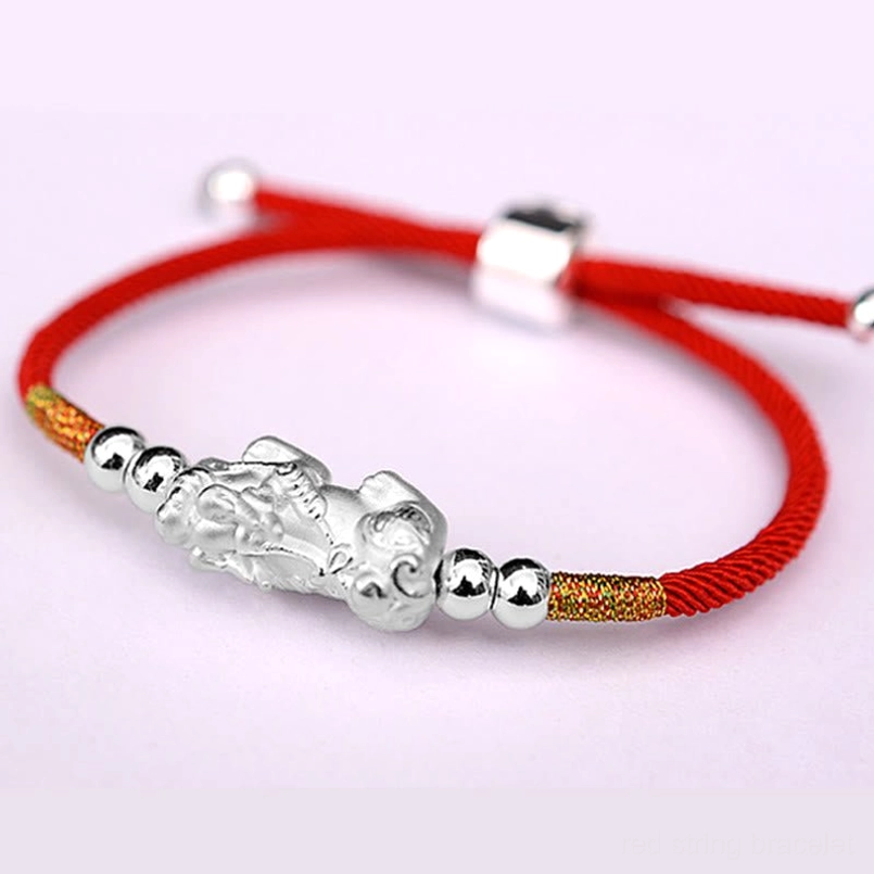 Red string with gold Pixiu charm prosperity bracelet on wrist styling