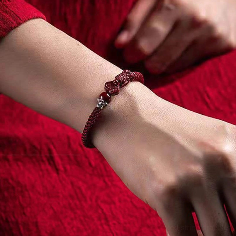 Pixiu wealth bracelet close-up showing cinnabar stone quality and craftsmanship