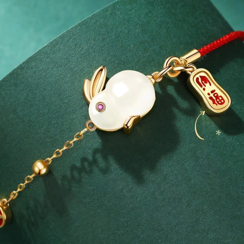 Rabbit red string bracelet polished metal links close up view