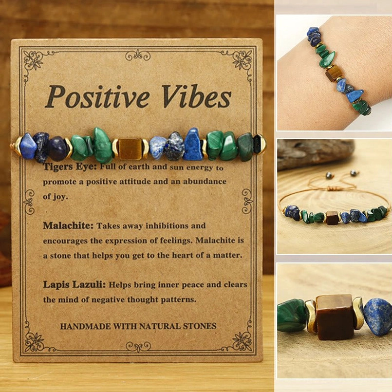 Positive Vibes natural stone bracelet with malachite tiger's eye and lapis lazuli beads on light wood background