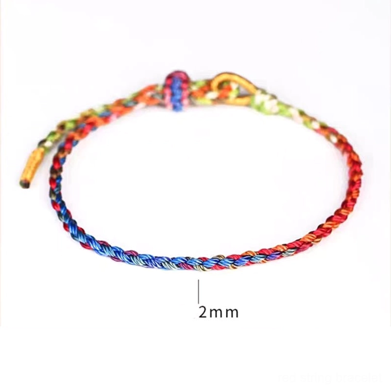 Thick braided 2mm lucky bracelet with woven knot and loose rope ends on white background