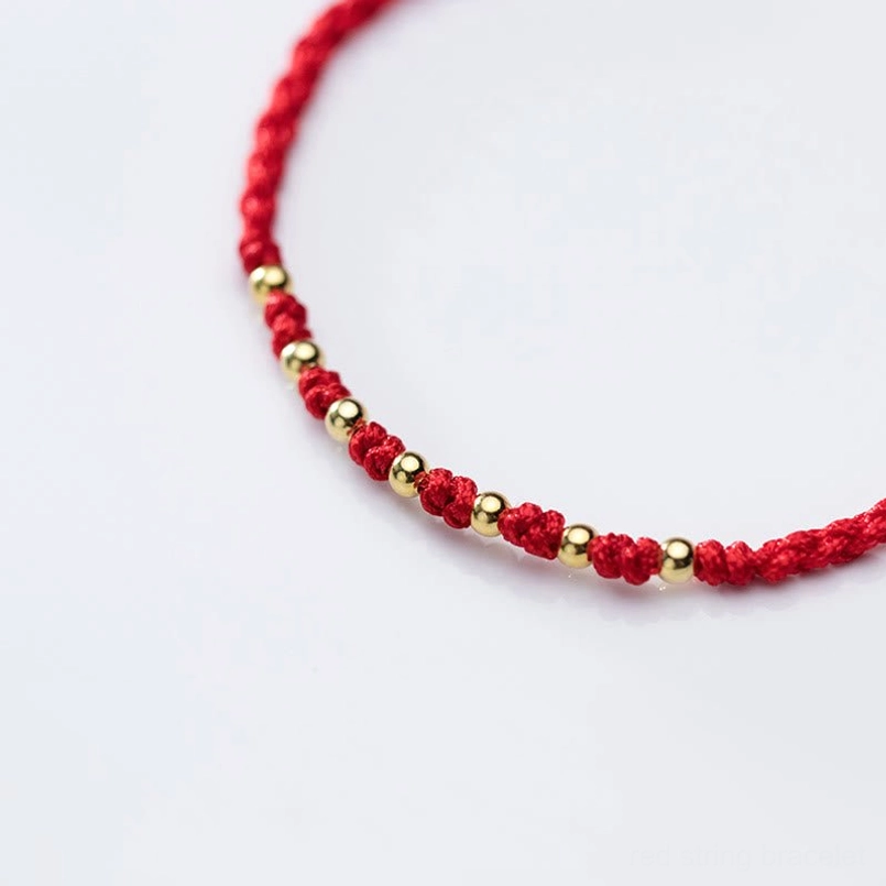 Red protection bracelet handmade with premium sterling silver and gold details