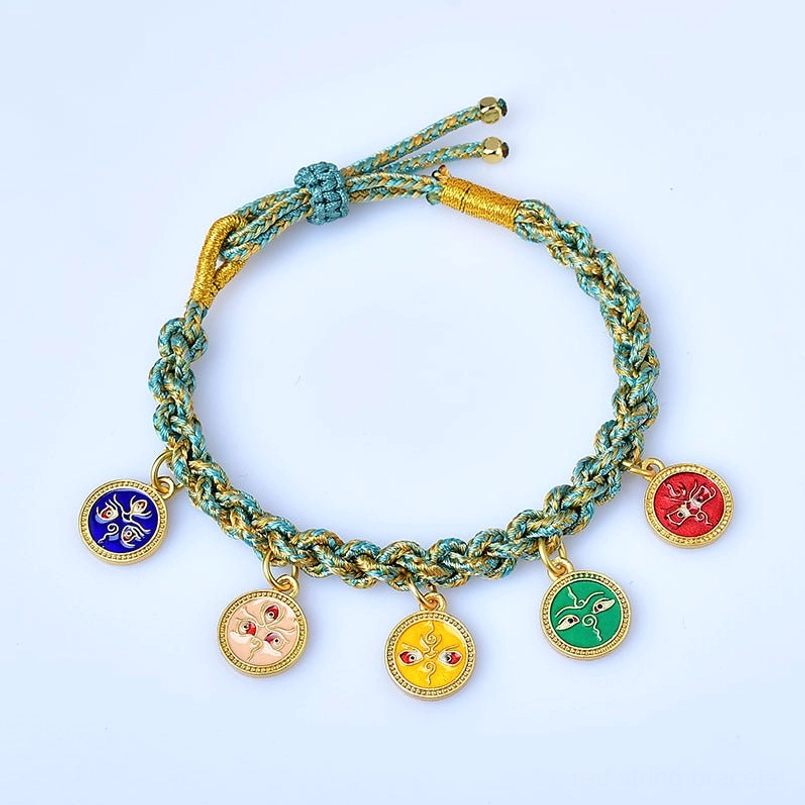 Tibetan five gods of wealth braided bracelet with gold accents on pure white background