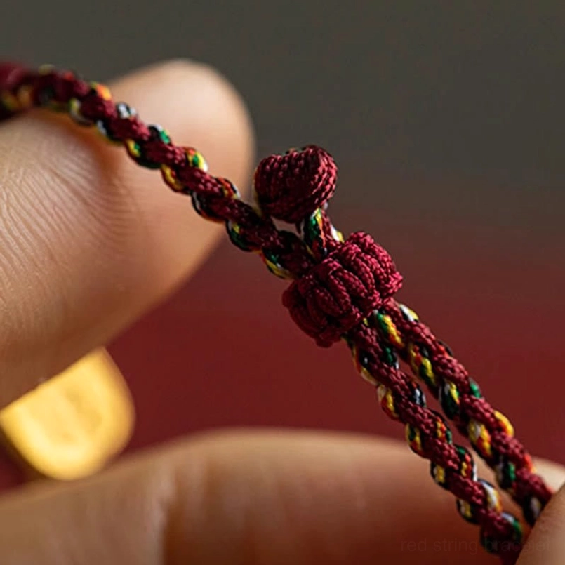 Braided prosperity bracelet with hetian jade and five-colored string close-up texture detail