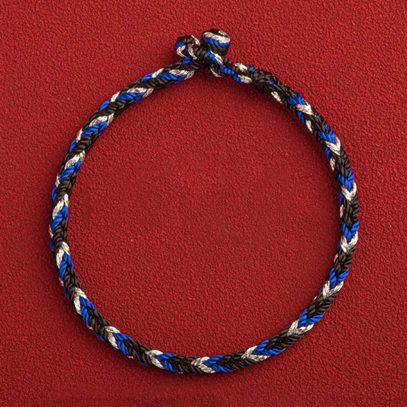 Three-strand twisted multicolored prosperity bracelet with double knot fastener, front view