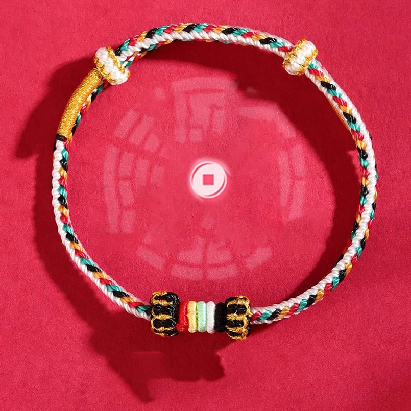 Coin-themed feng shui woven bracelet with multicolor braids, decorative fasteners and colorful spacer beads