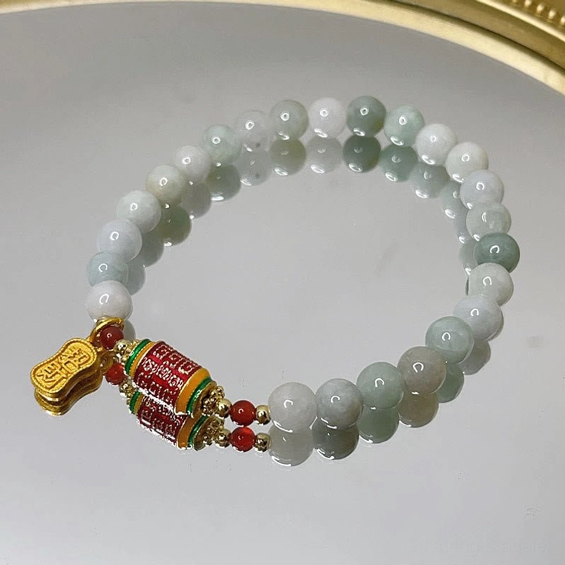 Flat Lay View Of Full Jade Prayer Wheel Prosperity Red String Bracelet
