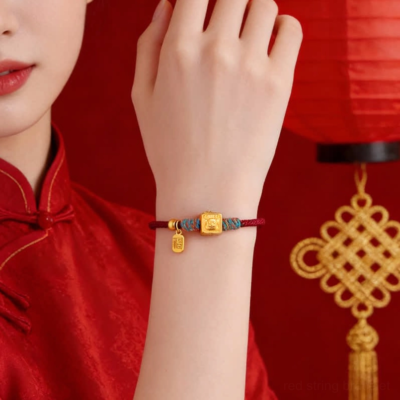 protective red string zodiac bracelet with decorative woven trim and Fu tag