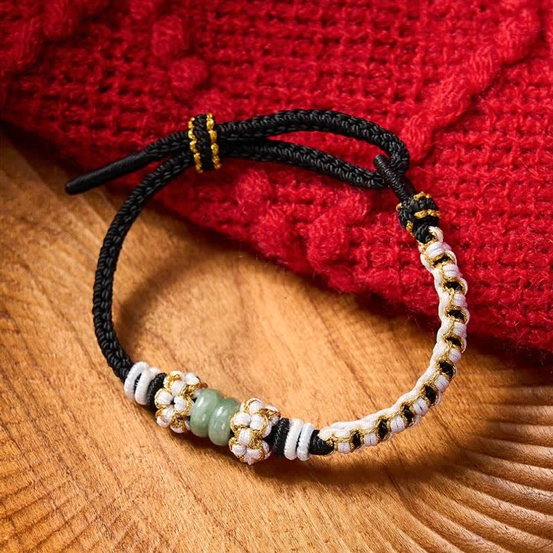 Purple Chinese knot bracelet with jade beads and braided details
