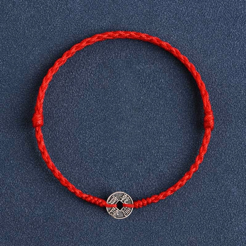 Qianlong Emperor red string bracelet featuring prosperity symbol silver coin on braided cord