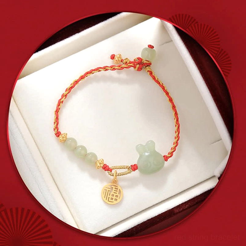 Year of the Rabbit Hetian jade red string bracelet displayed in luxury gift box