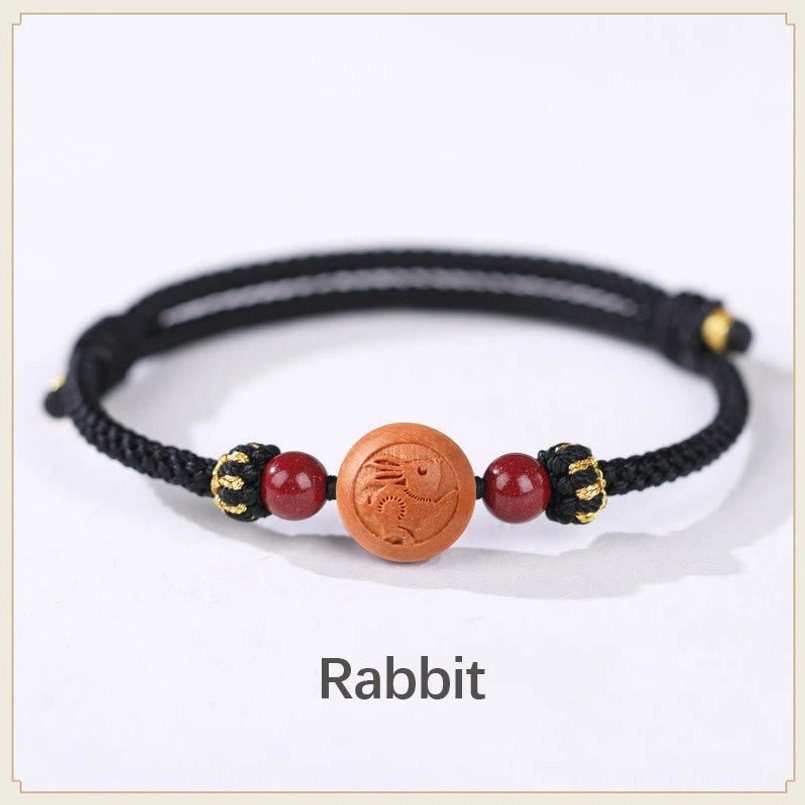 Rabbit zodiac peach wood black rope bracelet - gentle responsible energy fortune charm