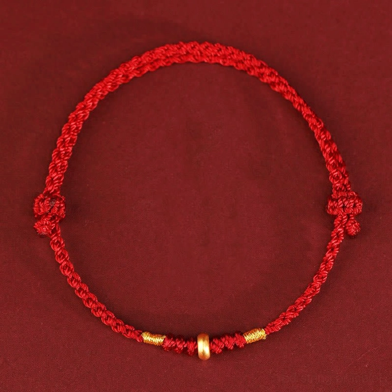 Red lucky string bracelet with double adjustable knots and gold accents