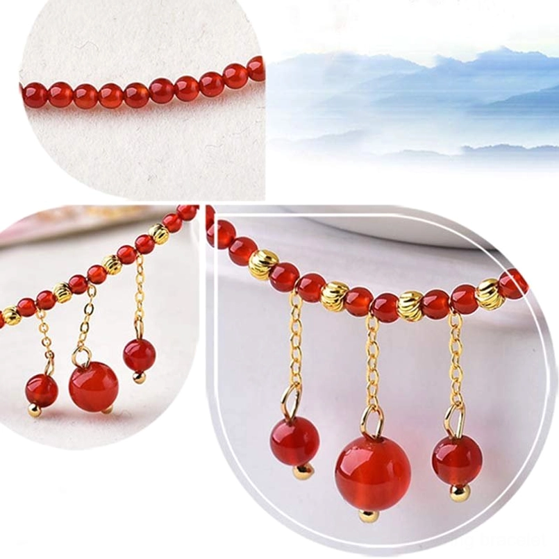 Red agate anklet macro close-up showing bead strands gold chains and large pendants texture