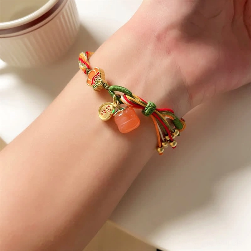 Persimmon red agate reincarnation knot bracelet adjustable sizing display