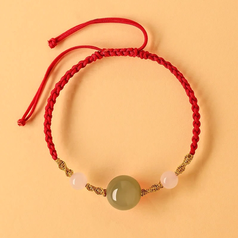 Red agate and jade red string bracelet, symmetrical flat lay, light background