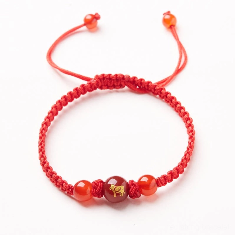 Red agate Chinese zodiac Ox bracelet with braided cord and adjustable fit