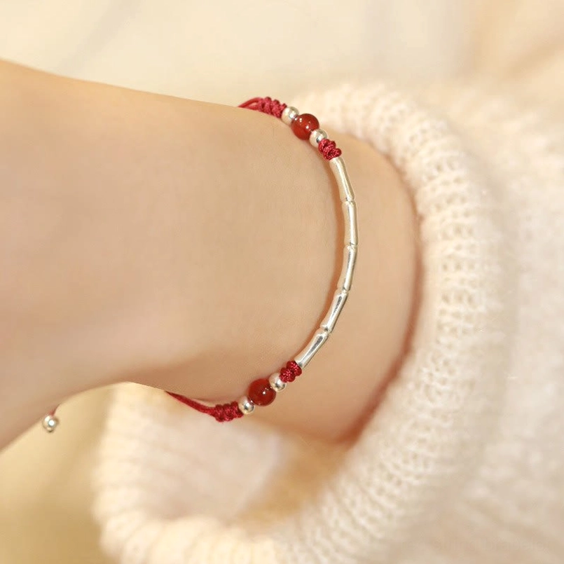 Red agate 925 sterling silver bamboo bracelet with red cord wrist view