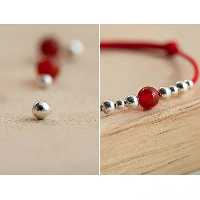 Loose red agate beads and silver components used in handmade fortune bracelet