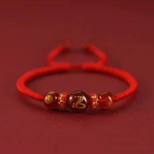 Snake Chinese zodiac red agate bracelet with golden engraving and protective red string