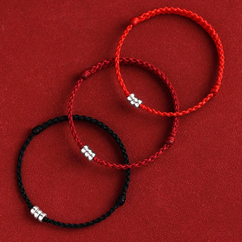 Collection of braided bracelets in red and black with sterling silver beads, multiple color options