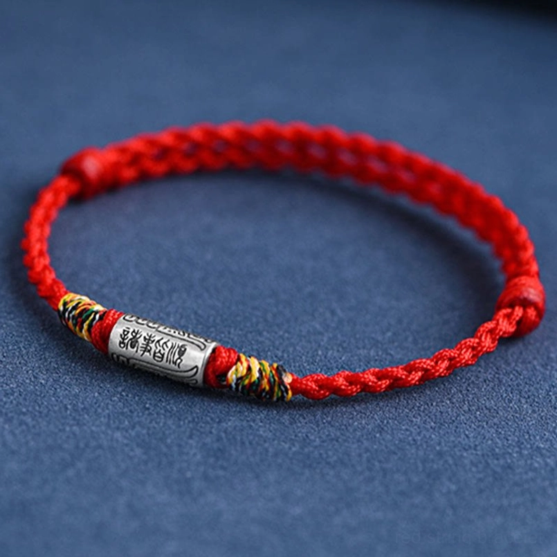 Red woven lucky bracelet with clear engraved Chinese text on sterling silver charm