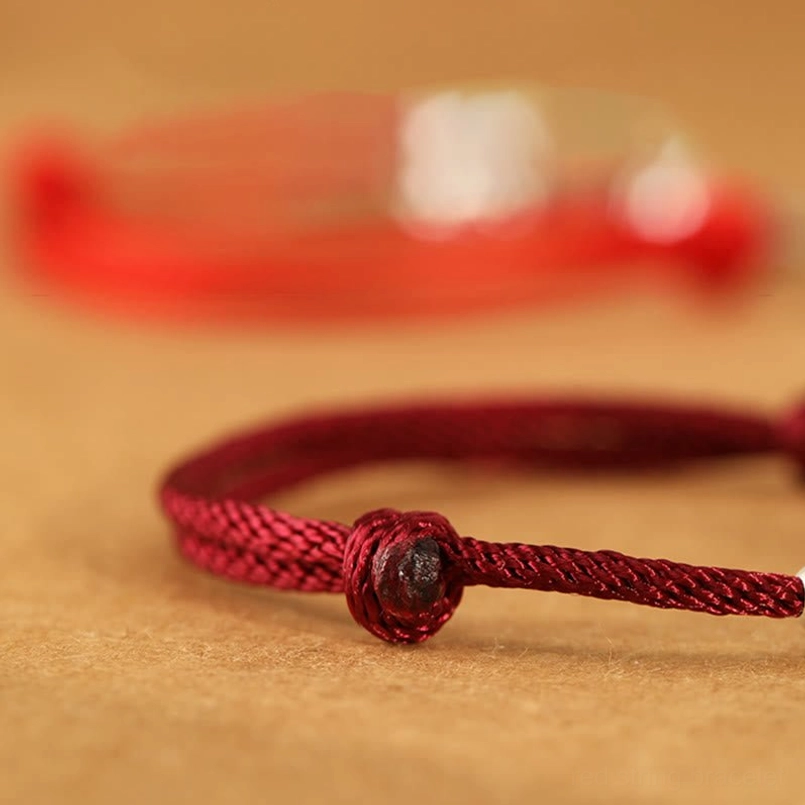 Woven decorative knot detail of red braided cord Year of the Horse fu character bracelet