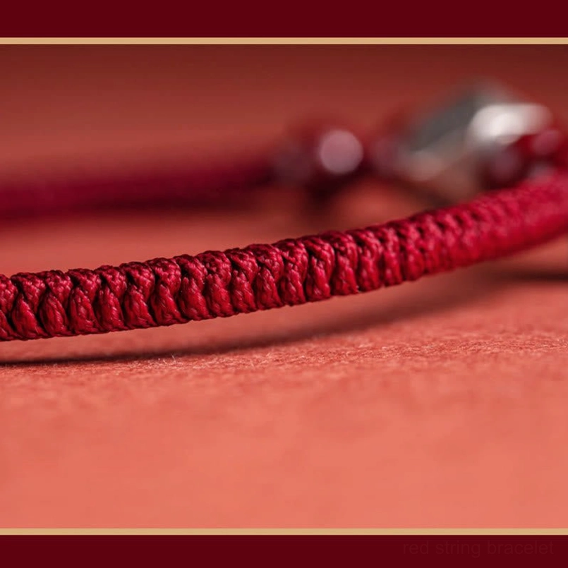 Close-up texture of tightly woven red braided cord red string zodiac bracelet adjustable design