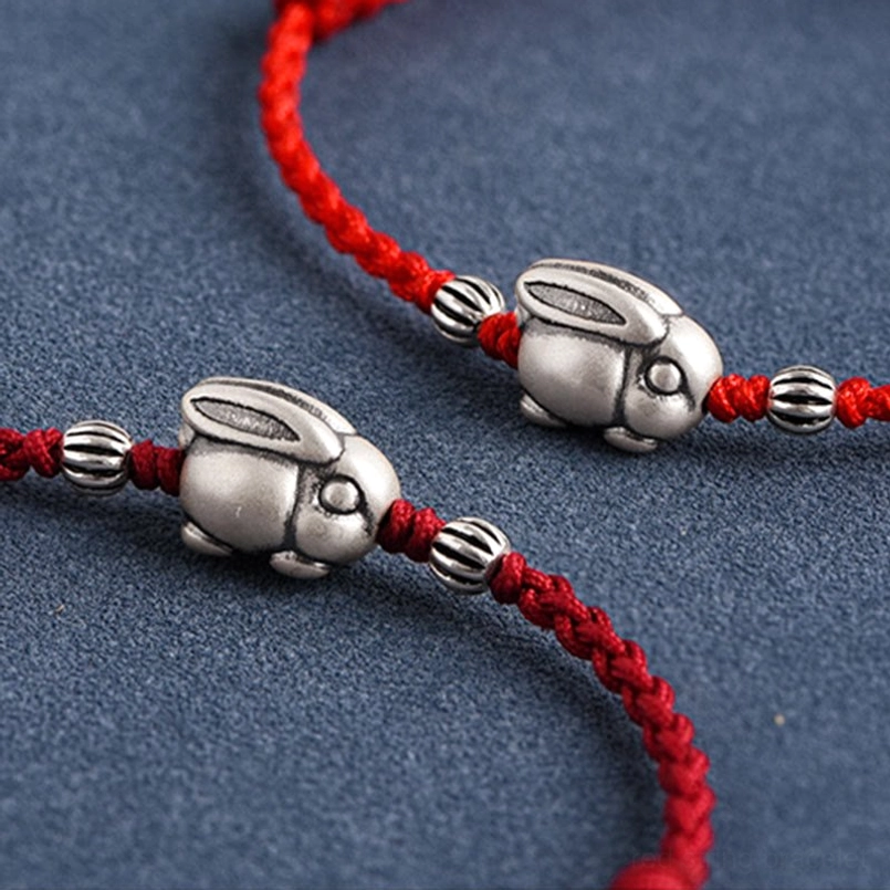 Red braided string rabbit charm bracelet with silver accent beads