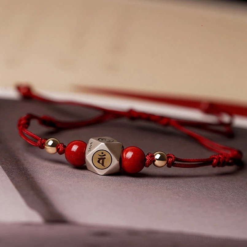 Red cinnabar zodiac natal Buddha bracelet with engraved silver center bead and gold accents