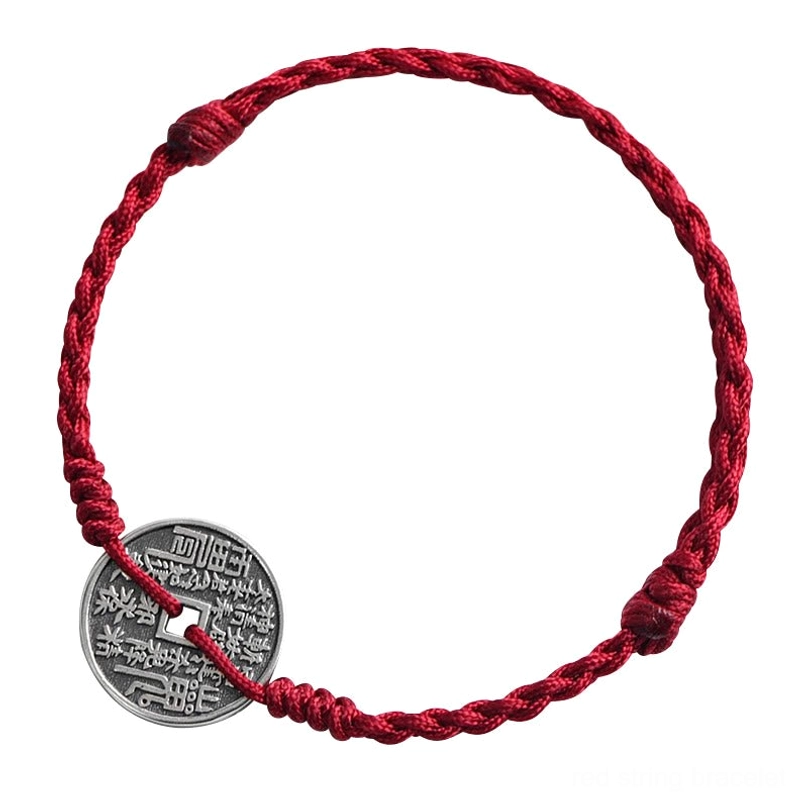Split red rope with antique square-hole silver coins flat lay display