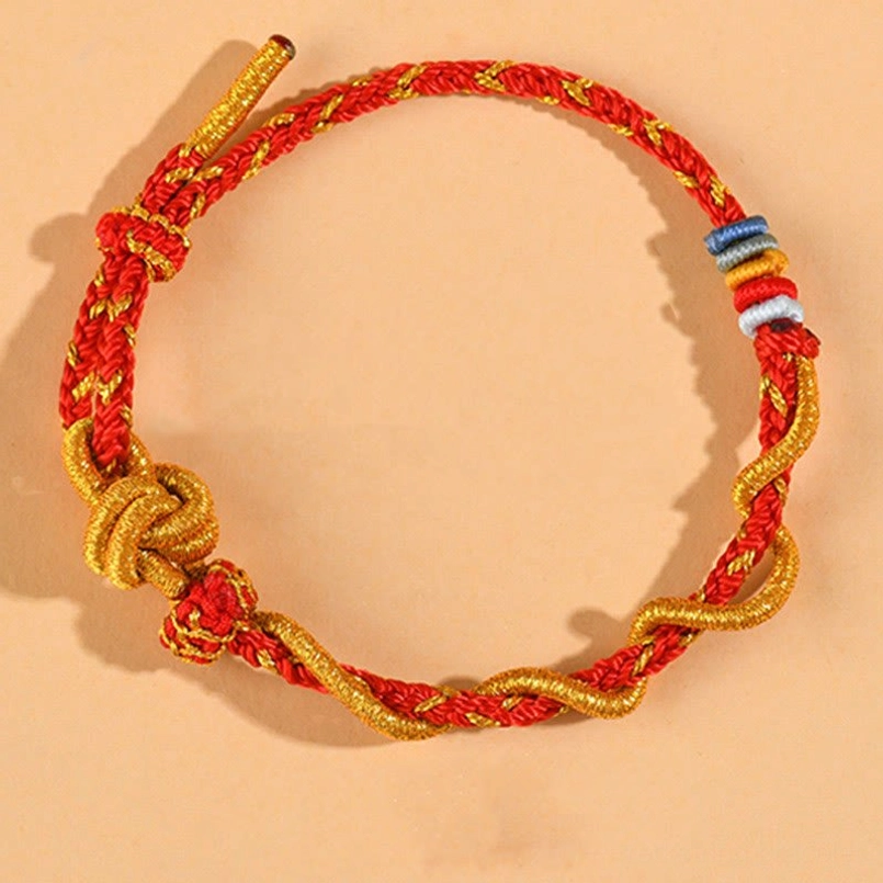 Red dimple knot luck bracelet combining traditional and modern spiritual symbolism