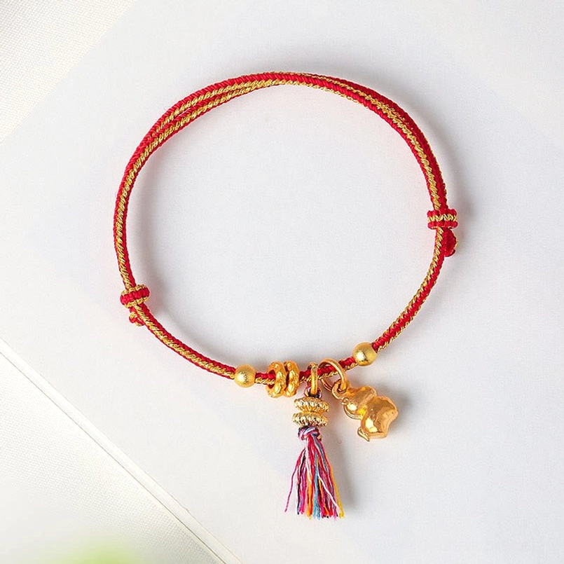 Red and gold braided zodiac horse bracelet with tassel