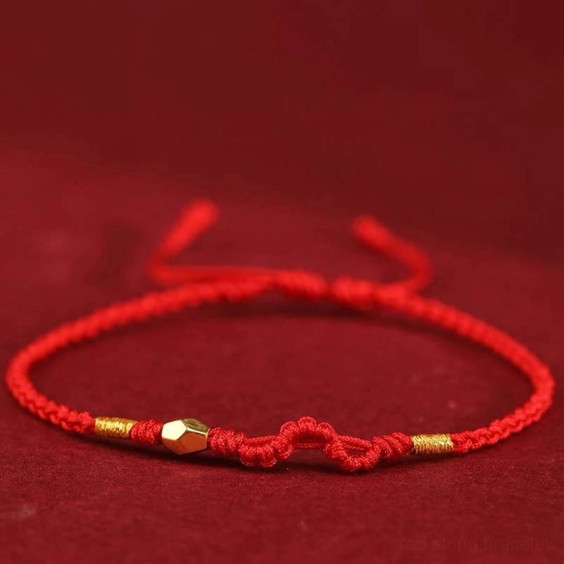 Red 999 gold year of the snake red string bracelet close up view