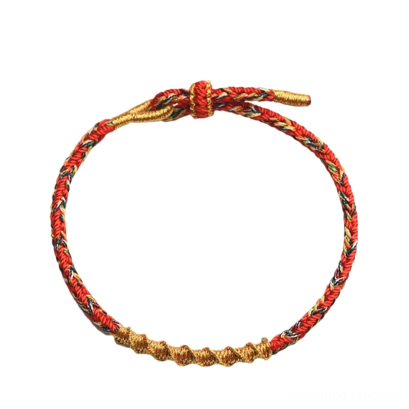 Single red gold twisted braided red string bracelet white background