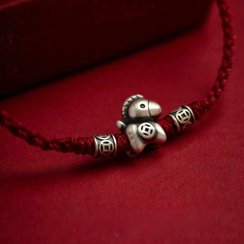 Wrist wearing shot of classic red zodiac horse protection bracelet