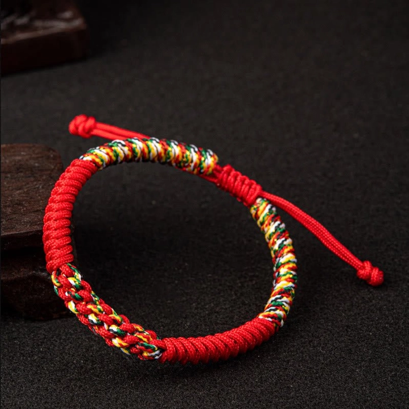 Red King Kong Knot bracelet side view showing braided rope and multicolor woven section