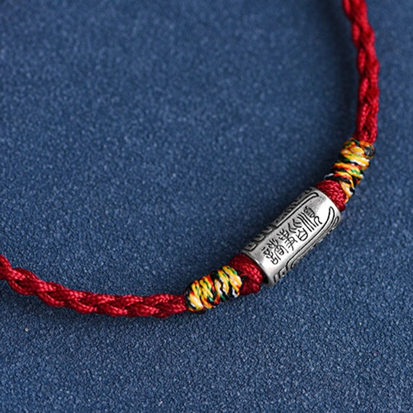 Red woven lucky bracelet with sterling silver charm perfect gift for meaningful occasions