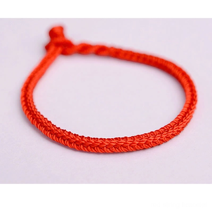 Red tibetan peace knot bracelet front flat view with braided cord design